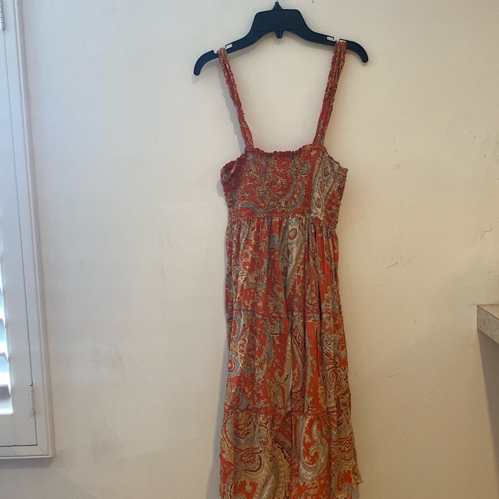 Orange dress has only been used once in good condition